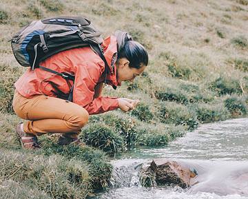 woman taking picture of water