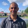 Man wearing gray polo shirt