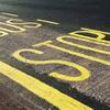 The words Bus Stop painted on the street