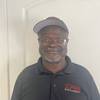 man wearing black polo shirt and cap