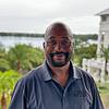 smiling man with short beard and polo shirt