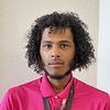 man with curly black hair