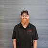 Man wearing black polo shirt