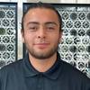 man with short beard and polo shirt