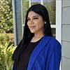 woman wearing black shirt and royal blue jacket