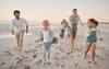 family running on beach