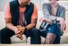 couple sitting on couch and laughing