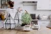 Kitchen island with lanterns, cup, and plate