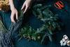 hands making wreath