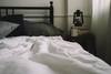 bed and side table with lantern