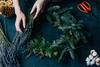 person making a wreath
