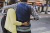 Couple hugging in street