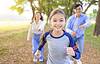 family running on trail outside