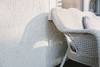 Wicker chair against wall