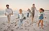 family running on beach