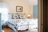 Bedroom with bed and wire bed frame