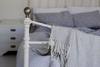 Bed with blanket over foot board