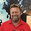 Man with blonde hair wearing red shirt