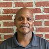 Man wearing gray polo shirt