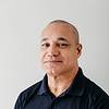 smiling man wearing polo shirt