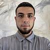 Man with short hair and short beard
