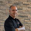 man wearing black polo shirt