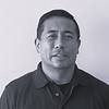man with short hair and polo shirt
