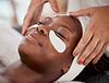 woman with eye masks getting spa treatment