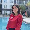 woman standing in front of pool