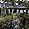 exterior shot of garden with fountain and ocean view