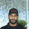 man with brimmed hat and short beard