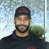 smiling man with short beard and baseball cap