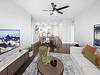 Modern living room with a view, sleek furniture, and tasteful decor.