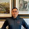 man in black polo shirt