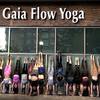 Outside view of Gaia Flow Yoga Uptown with people doing handstands