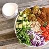 Salad with side of dressing on table