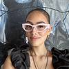 woman wearing glasses with light pink frame