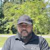 man wearing black shirt and cap