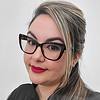 woman with straight hair and glasses