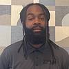 man with beard and polo shirt