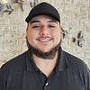 man wearing baseball cap and black shirt