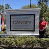 woman standing next to property sign