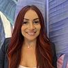smiling woman with long red hair