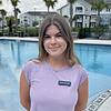 Woman smiling by pool