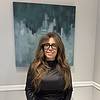 woman with long hair and glasses