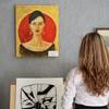 Woman looking at art