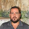man with beard and polo shirt