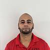 man wearing red polo shirt