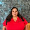 woman with long hair and polo shirt