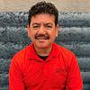 man with mustache and wearing red shirt